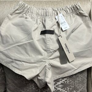 Fear of God Essentials running shorts. Smoke (beige). New w/tags. Mens XXS